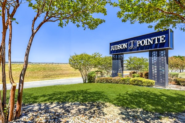 Judson Pointe Apartments signage highlighting luxury amenities in a vibrant community setting