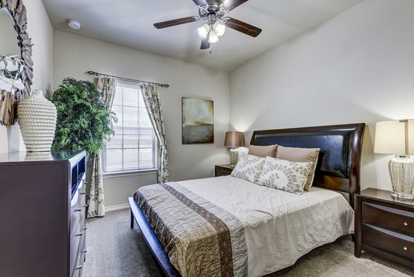 Bedroom featuring elegant decor and modern furnishings at Judson Pointe Apartments, luxury living in a Greystar community