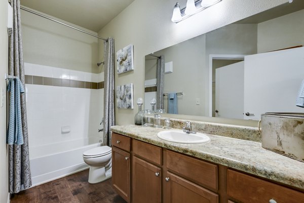 Contemporary bathroom featuring elegant fixtures at Judson Pointe Apartments, perfect for luxury living
