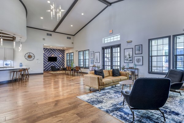 Clubhouse lounge with modern seating and vibrant decor at Judson Pointe Apartments