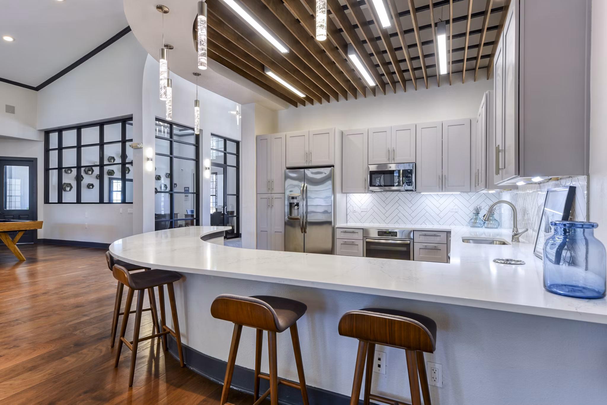 Elegant clubhouse/lobby with modern decor at Judson Pointe Apartments, featuring comfortable seating and stylish lighting fixtures