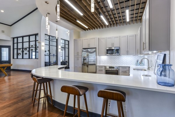 Elegant clubhouse/lobby with modern decor at Judson Pointe Apartments, featuring comfortable seating and stylish lighting fixtures