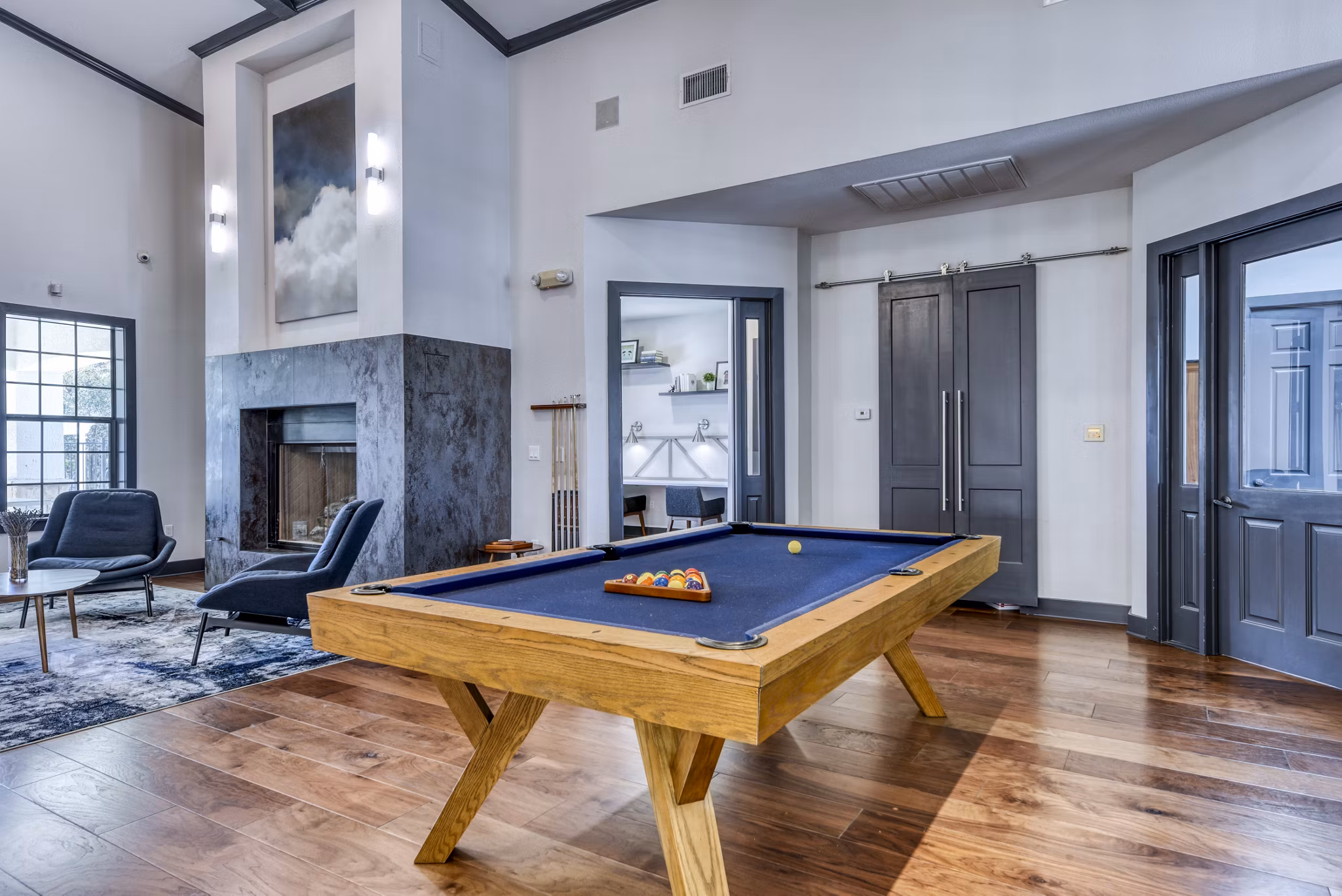 Clubhouse game room featuring modern decor and pool table at Judson Pointe Apartments