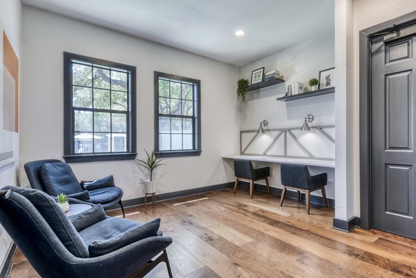 Modern business center with workstations at Judson Pointe Apartments clubhouse