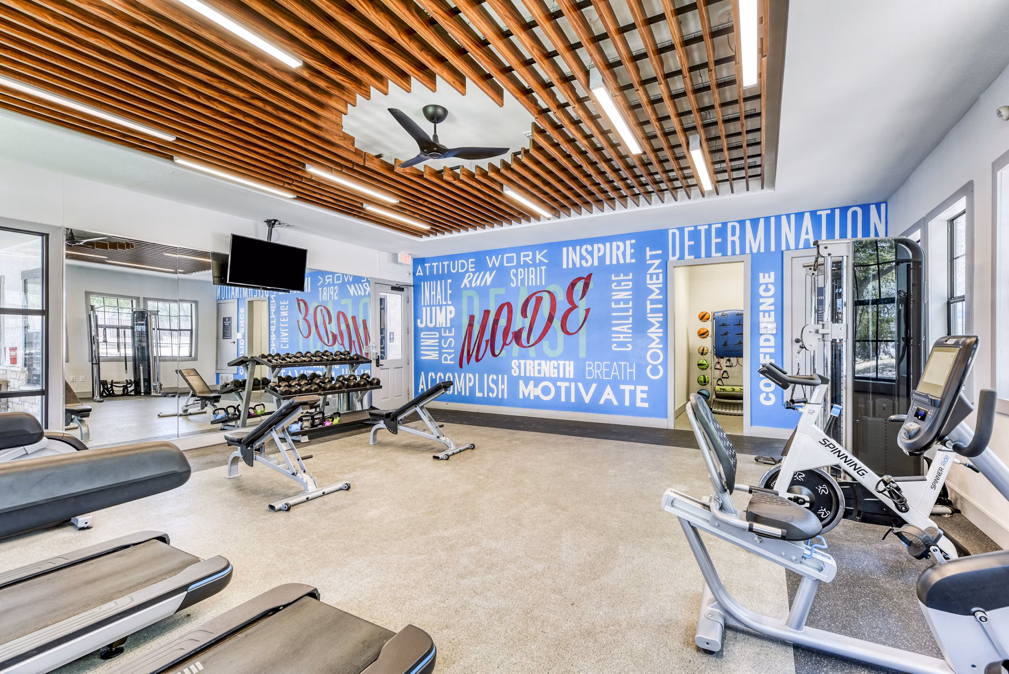Modern fitness center equipped with state-of-the-art machines at Judson Pointe Apartments