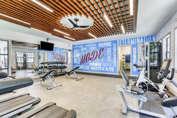 Modern fitness center equipped with state-of-the-art machines at Judson Pointe Apartments