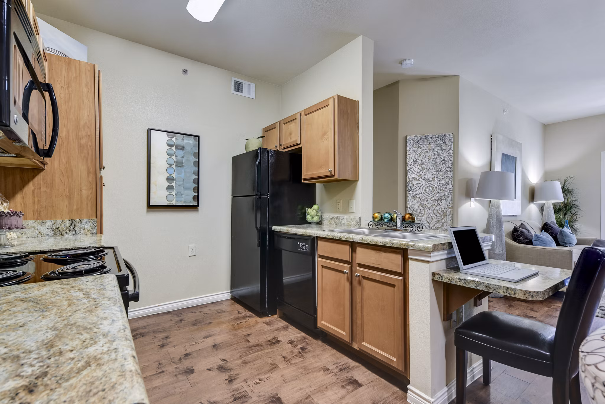 Modern kitchen with stainless steel appliances at Judson Pointe Apartments in the luxury Greystar community