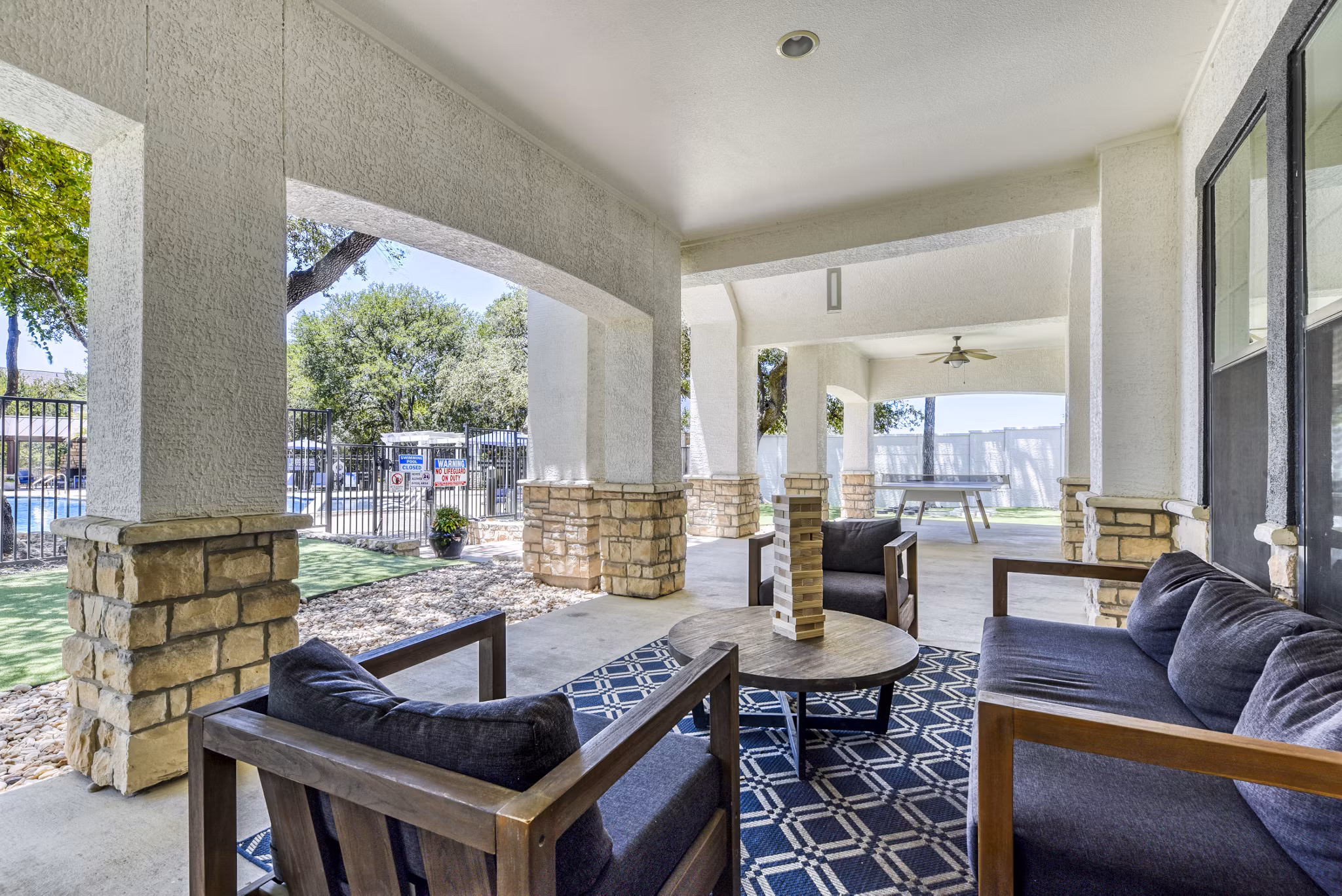 Patio featuring cozy seating and modern design at Judson Pointe Apartments, ideal for outdoor relaxation and gatherings