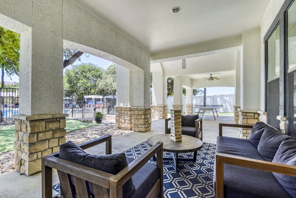 Patio featuring cozy seating and modern design at Judson Pointe Apartments, ideal for outdoor relaxation and gatherings