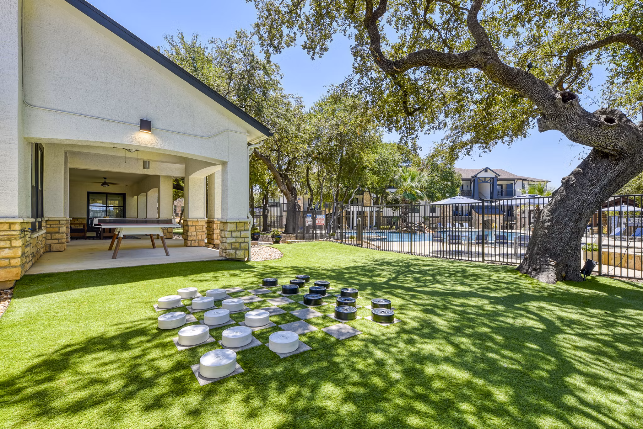 Recreational area with green spaces and seating at Judson Pointe at Town Centre Apartments