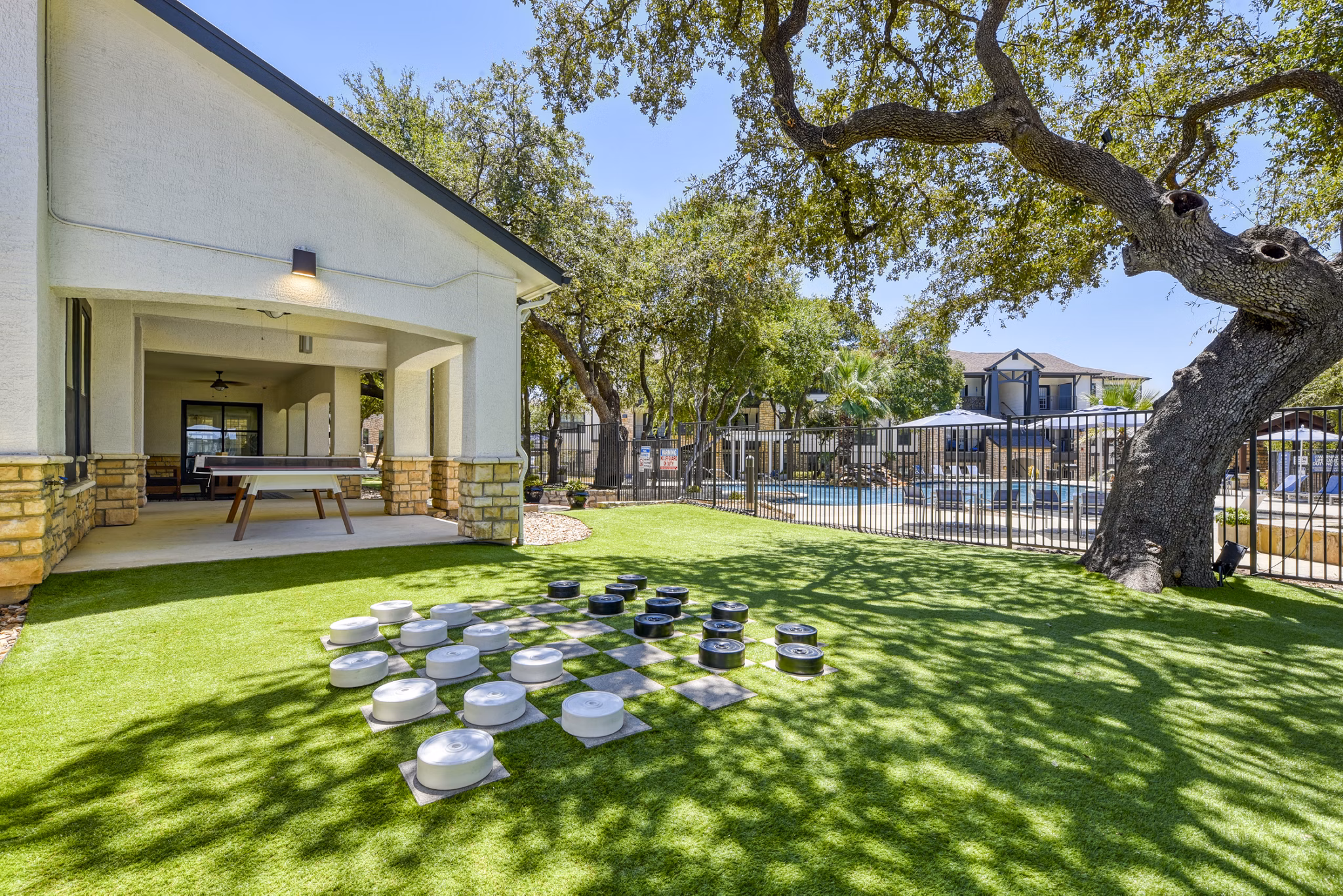 Recreational area with green spaces and seating at Judson Pointe at Town Centre Apartments