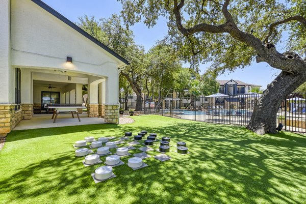 Recreational area with green spaces and seating at Judson Pointe at Town Centre Apartments