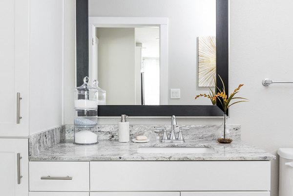 Stylish bathroom with modern fixtures at Stella at Riverstone Apartments