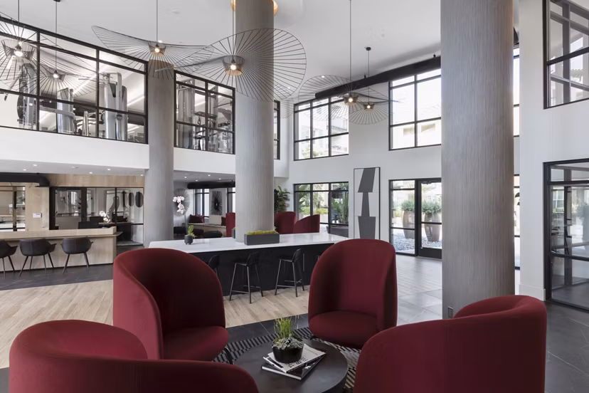 Modern theater with plush seating and advanced AV technology at Revela Apartments