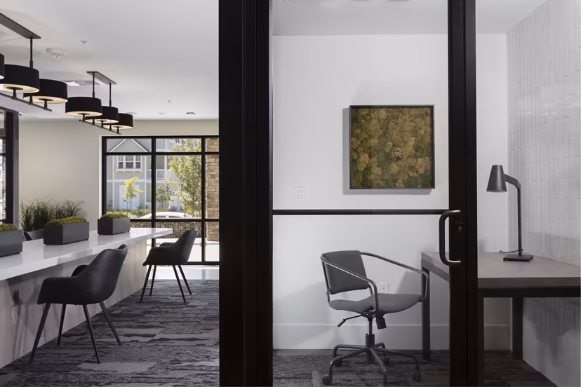 Modern clubhouse and meeting facility at Revela Apartments offering flexible spaces for social and business gatherings