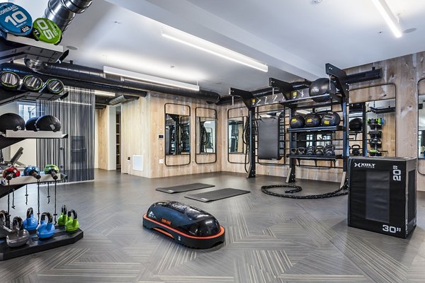 Revela Apartments: State-of-the-art fitness center with modern equipment in luxury community