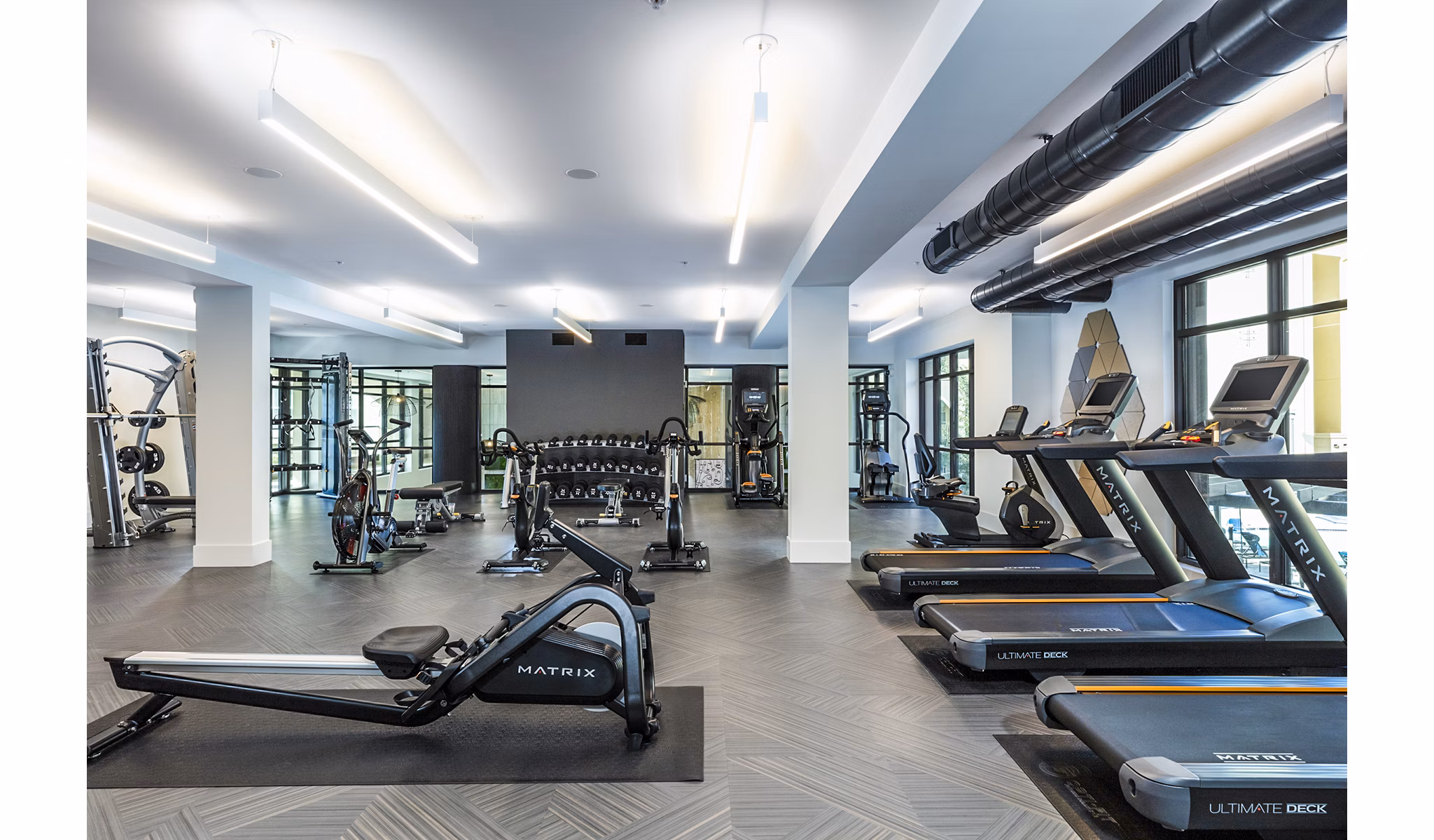 State-of-the-art fitness center with modern equipment at Revela Apartments, ideal for active lifestyles and wellness-focused residents