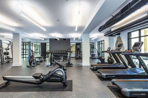 State-of-the-art fitness center with modern equipment at Revela Apartments, ideal for active lifestyles and wellness-focused residents