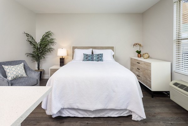 Luxurious bedroom with modern furnishings at Entrada Apartments