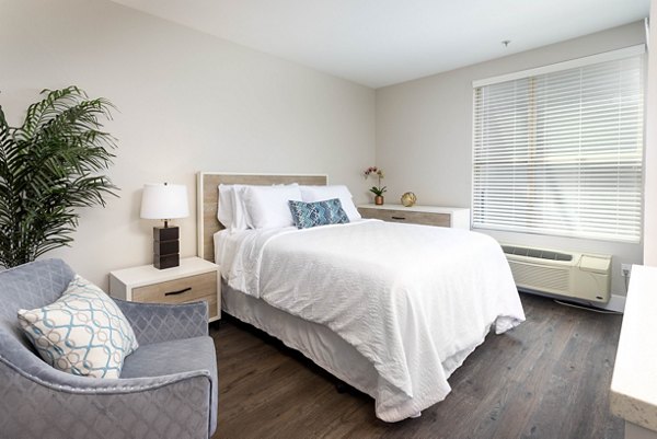 Entrada Apartments: Stylish bedroom with modern furnishings