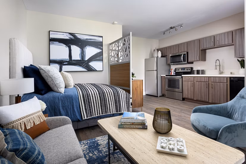 Entrada Apartments: Modern kitchen with stainless steel appliances and granite countertops at luxury apartments in prime location