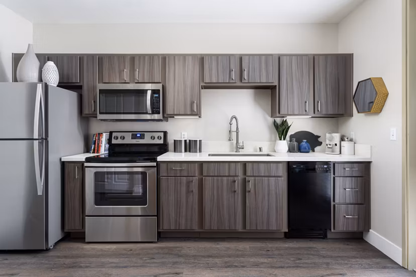 Modern kitchen with stainless steel appliances at Entrada Apartments, a luxury Greystar property