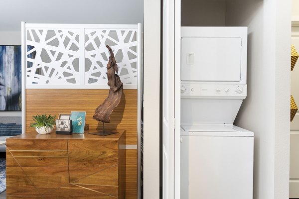 Modern laundry room with state-of-the-art appliances at Entrada Apartments, ensuring convenience and efficiency for residents