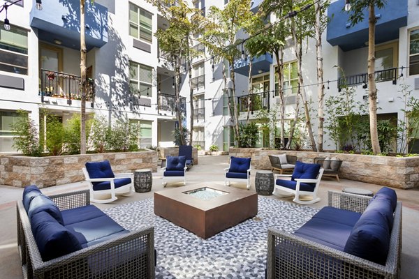 Cozy fire pit at Entrada Apartments offering a perfect spot for gathering and relaxation