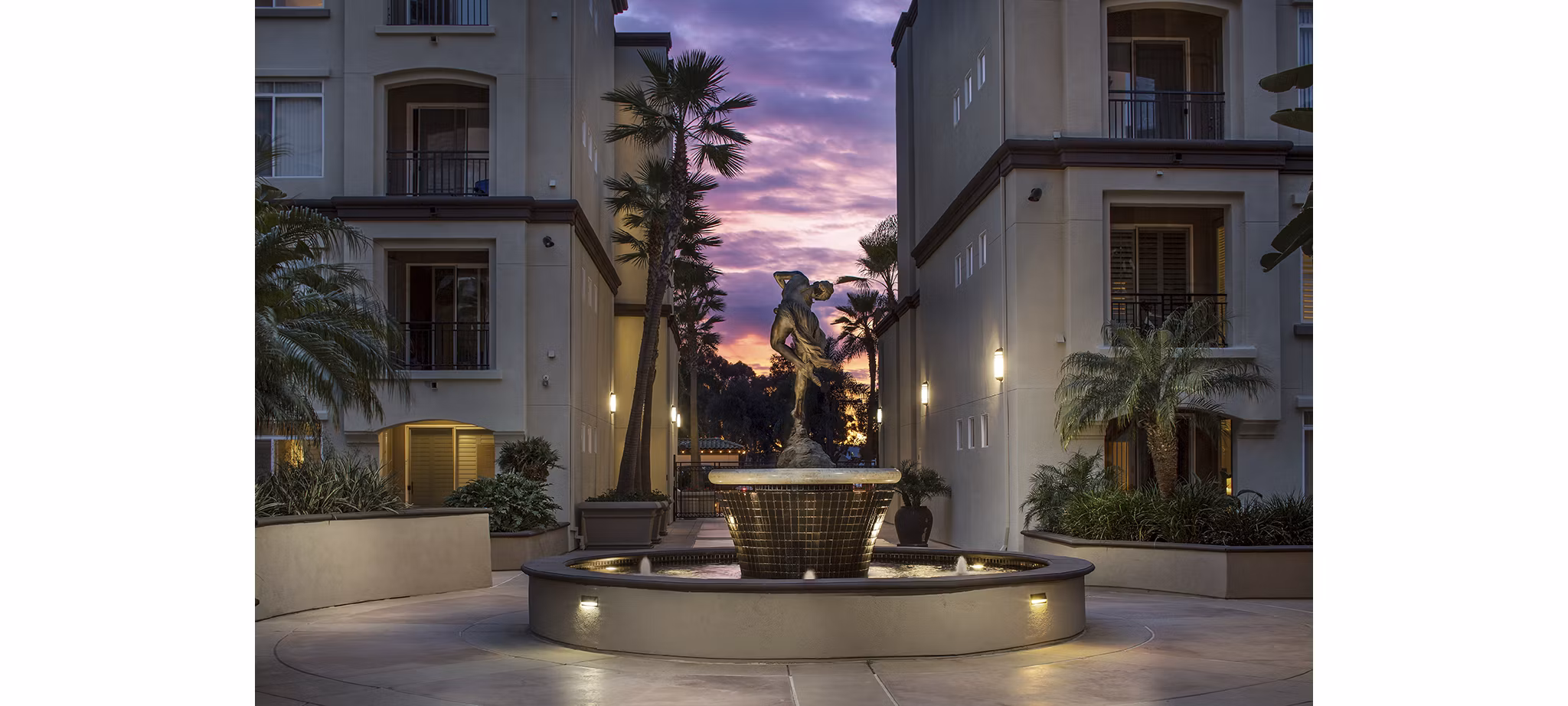 Regents La Jolla: Contemporary apartment building featuring lush landscaping in a luxury community