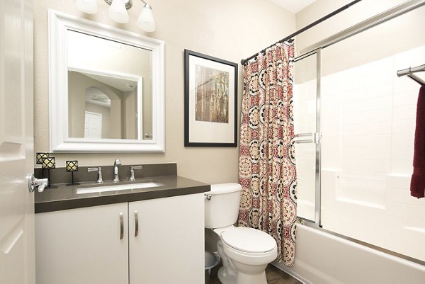 Modern bathroom featuring sleek fixtures and ample lighting at Regents La Jolla Apartments luxury residences