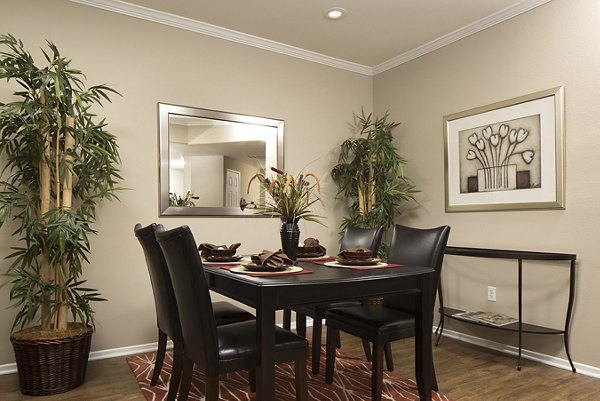 Elegant dining room with designer lighting at Regents La Jolla Apartments