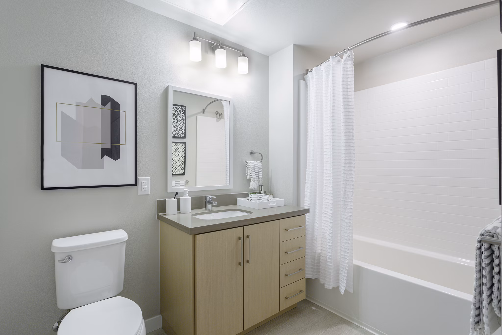 Modern bathroom with sleek fixtures at THEO luxury apartments
