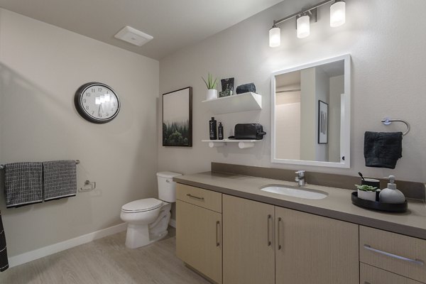 Modern bathroom featuring sleek fixtures and marble countertops at THEO luxury apartments