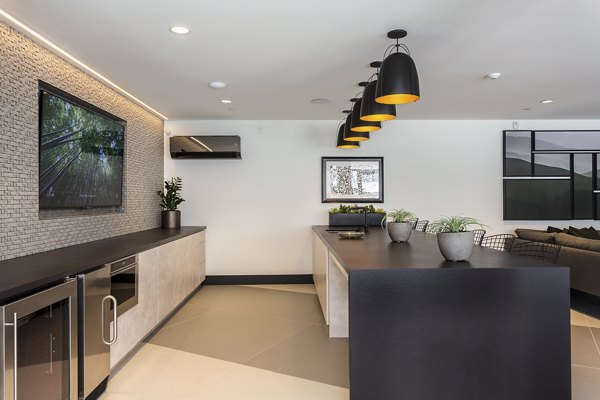 Clubhouse at THEO: Elegant space with comfortable seating and modern decor for residents of luxury apartments