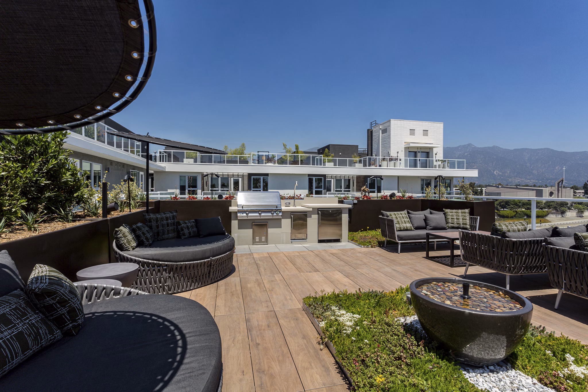 Grill area with modern seating at THEO luxury apartments