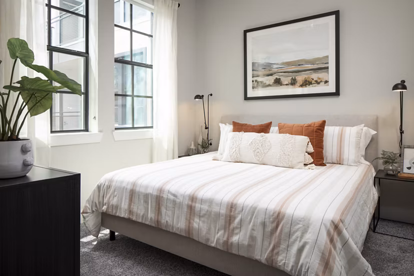 Stylish bedroom with contemporary decor at Broadstone Sawyer Yards Apartments