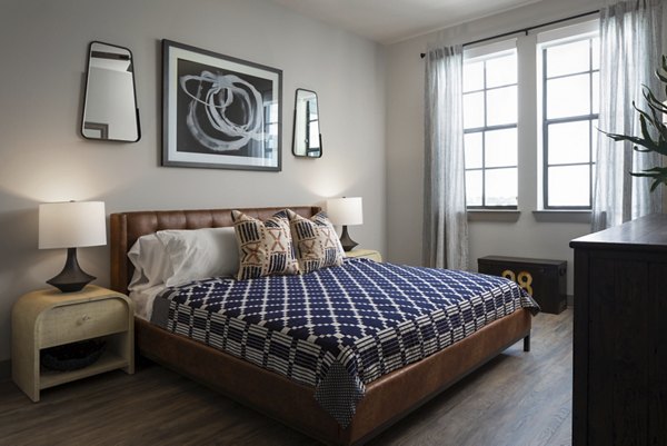 Spacious bedroom with modern decor at Broadstone Sawyer Yards Apartments in Houston