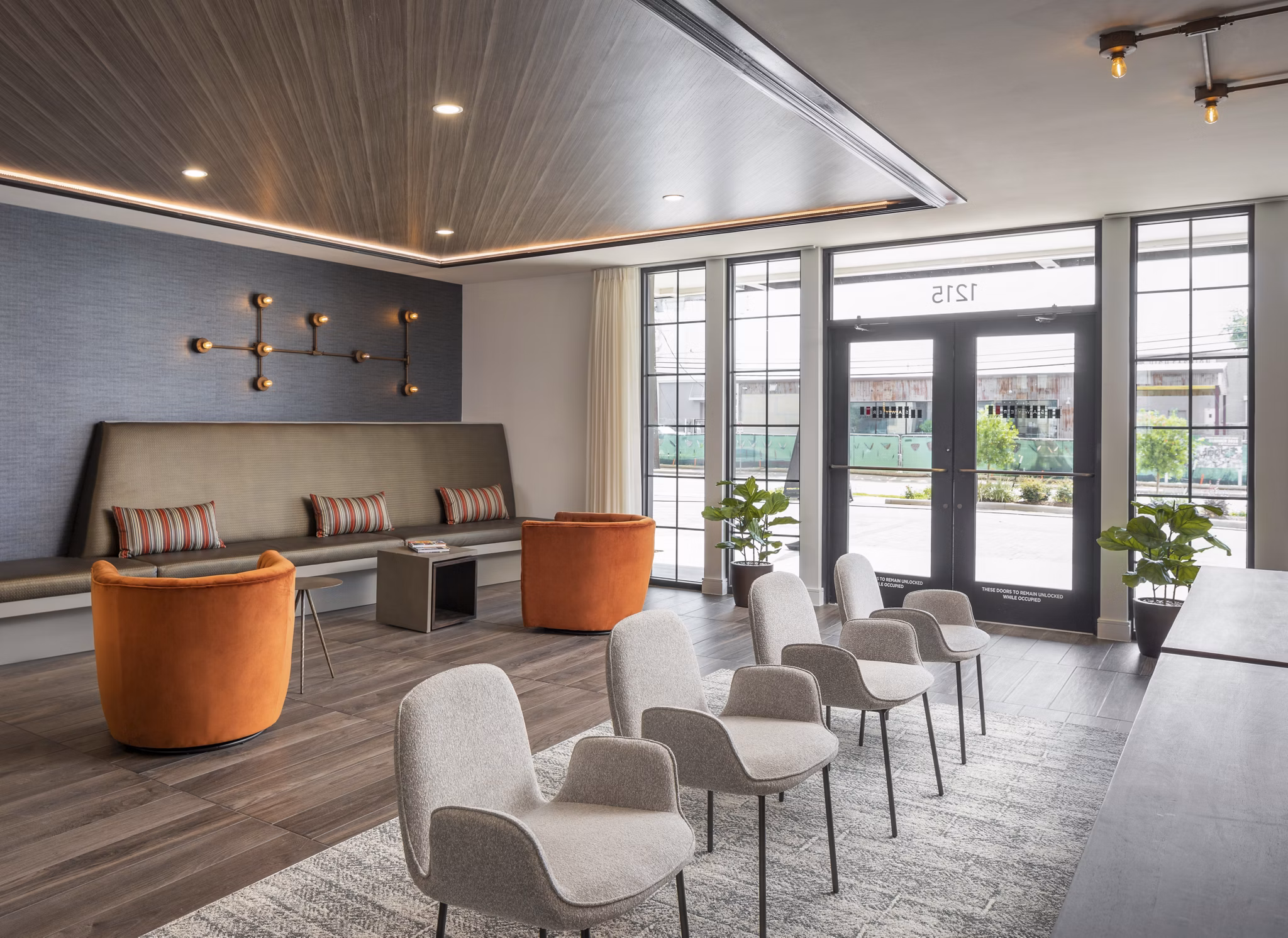 Clubhouse with modern design and ample seating at Broadstone Sawyer Yards Apartments