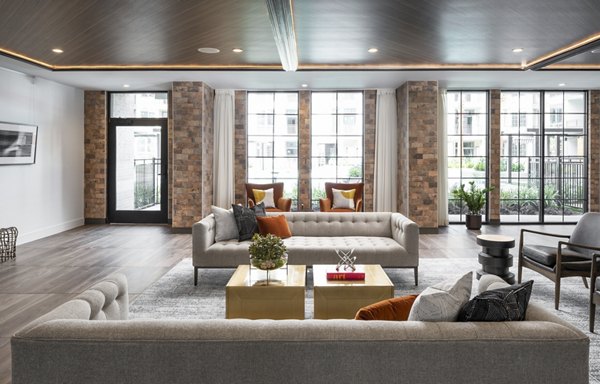 Clubhouse featuring modern design and comfortable seating at Broadstone Sawyer Yards Apartments in Houston, Texas