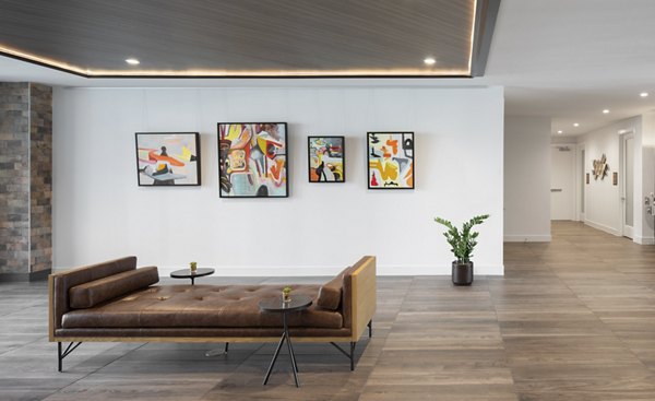 Clubhouse featuring a stylish lounge and modern design at Broadstone Sawyer Yards Apartments