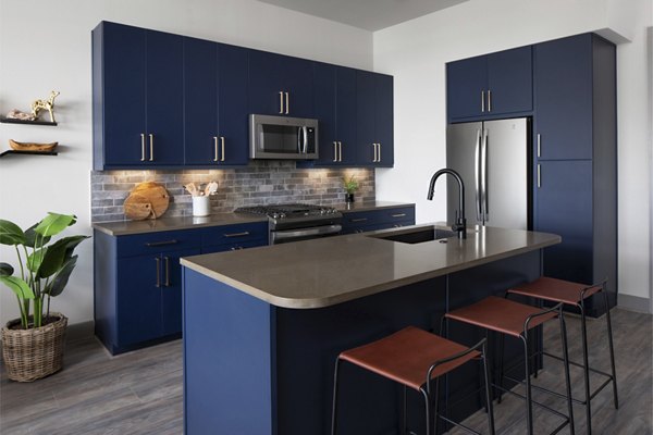 Modern kitchen with sleek countertops and stainless steel appliances at Broadstone Sawyer Yards Apartments