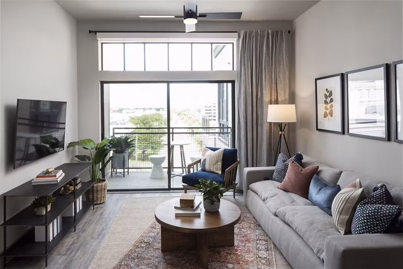 Modern living room with comfy seating and large windows at Broadstone Sawyer Yards, luxury apartments in vibrant neighborhood