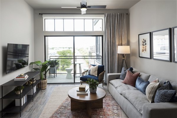 Modern living room with comfy seating and large windows at Broadstone Sawyer Yards, luxury apartments in vibrant neighborhood
