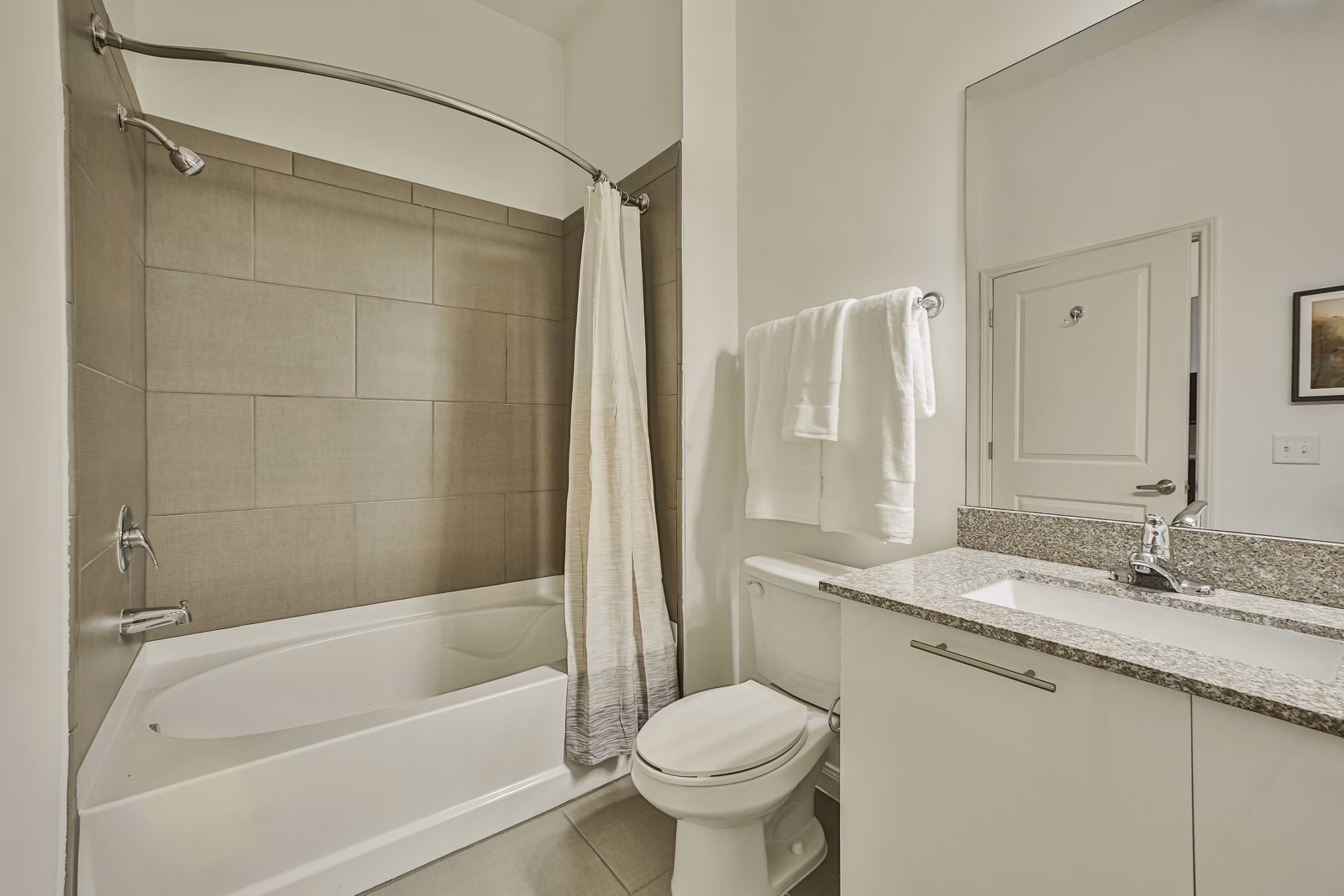Bathroom featuring modern fixtures and marble countertops at Broadstone Toscano Apartments