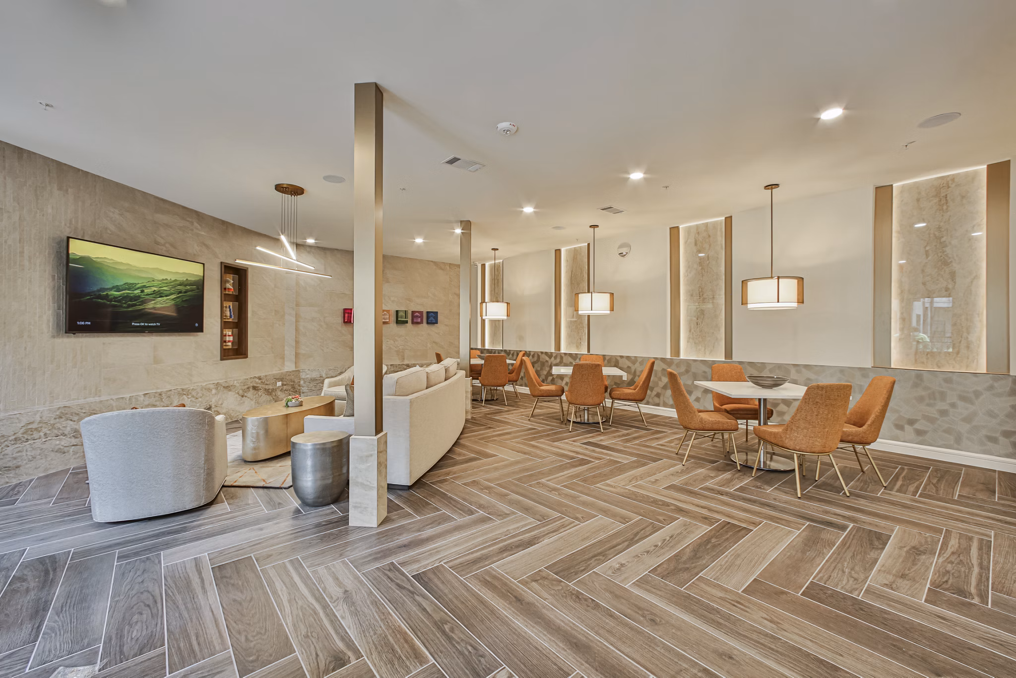 Clubhouse featuring modern design and seating areas at Broadstone Toscano Apartments