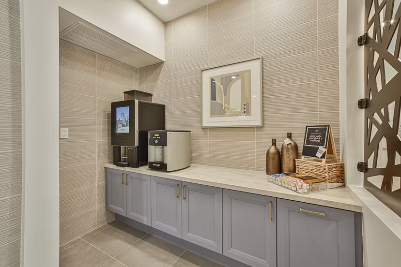 Clubhouse featuring modern seating and vibrant decor at Broadstone Toscano Apartments