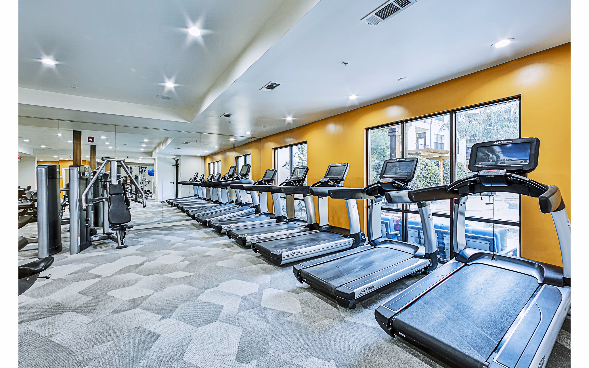 Modern fitness center with state-of-the-art equipment at Broadstone Toscano Apartments, ideal for luxury living and active lifestyles