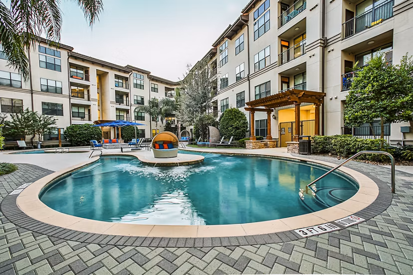 Resort-style pool with cabanas at Broadstone Toscano Apartments, perfect for relaxation and recreation in luxury living setting