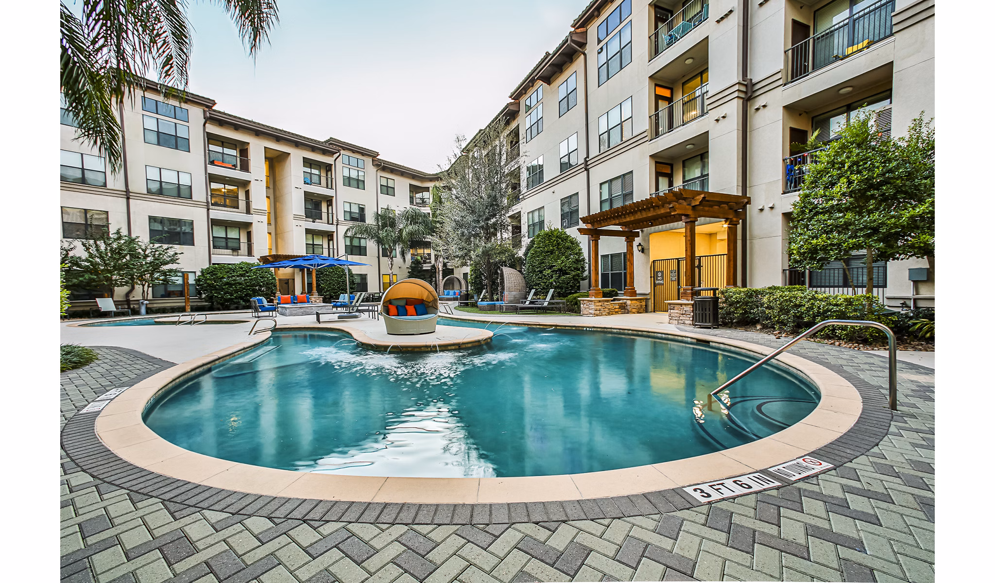 Resort-style pool with cabanas at Broadstone Toscano Apartments, perfect for relaxation and recreation in luxury living setting