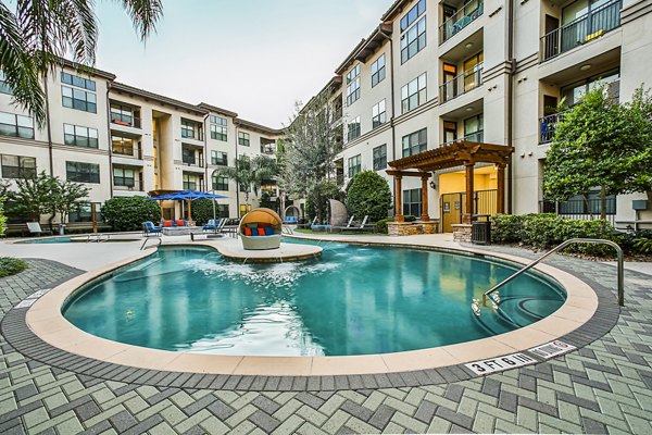 Resort-style pool with cabanas at Broadstone Toscano Apartments, perfect for relaxation and recreation in luxury living setting